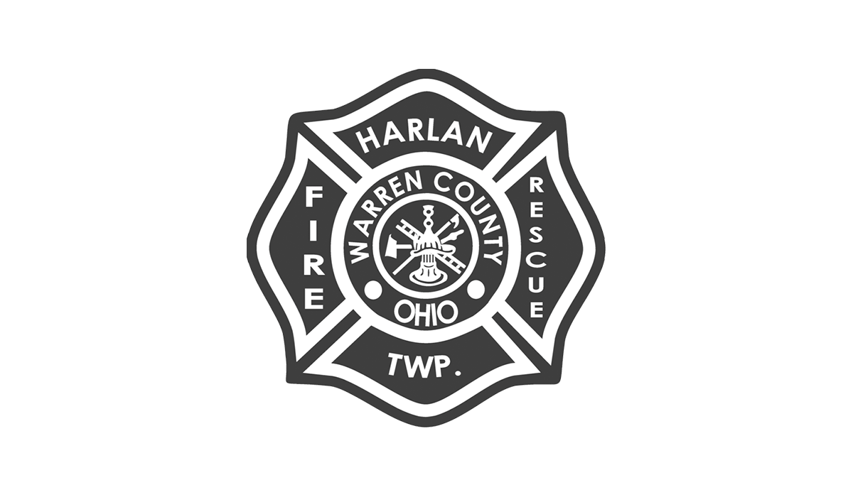 A black and white emblem for Harlan Township Fire Rescue in Warren County, Ohio. The emblem features a cross design with "Harlan Fire Rescue Twp." on the arms and "Warren County Ohio" in a central circle with firefighting symbols.